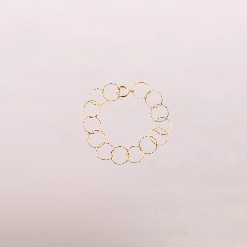 Bracciale dorato a cerchi intrecciati – Aria